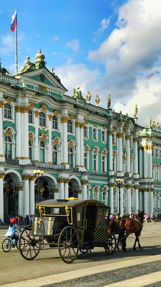 Horse carriage passing by the Hermitage museum in St Petersburg